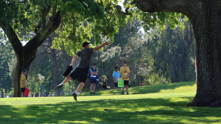 A disc golfer demonstrating a type of putting throw